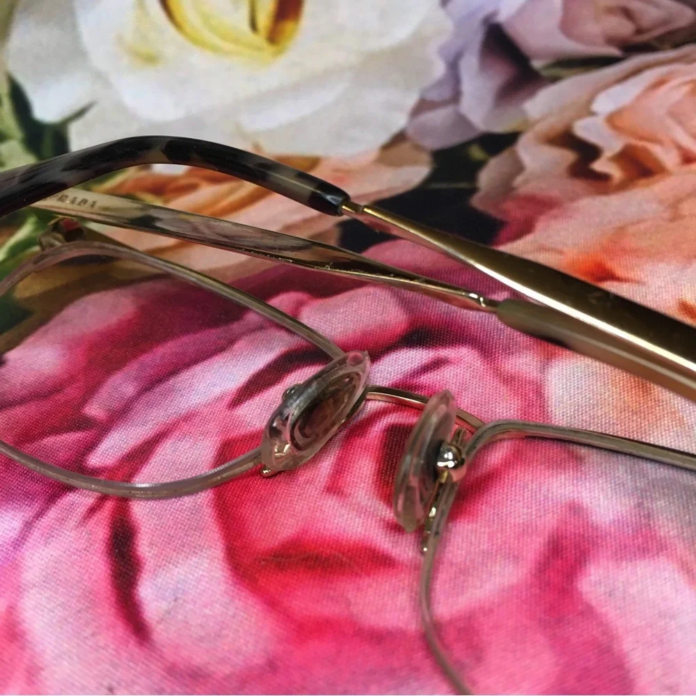 Prada Black top rim & Gold metal bottom rim and arms Good stored condition